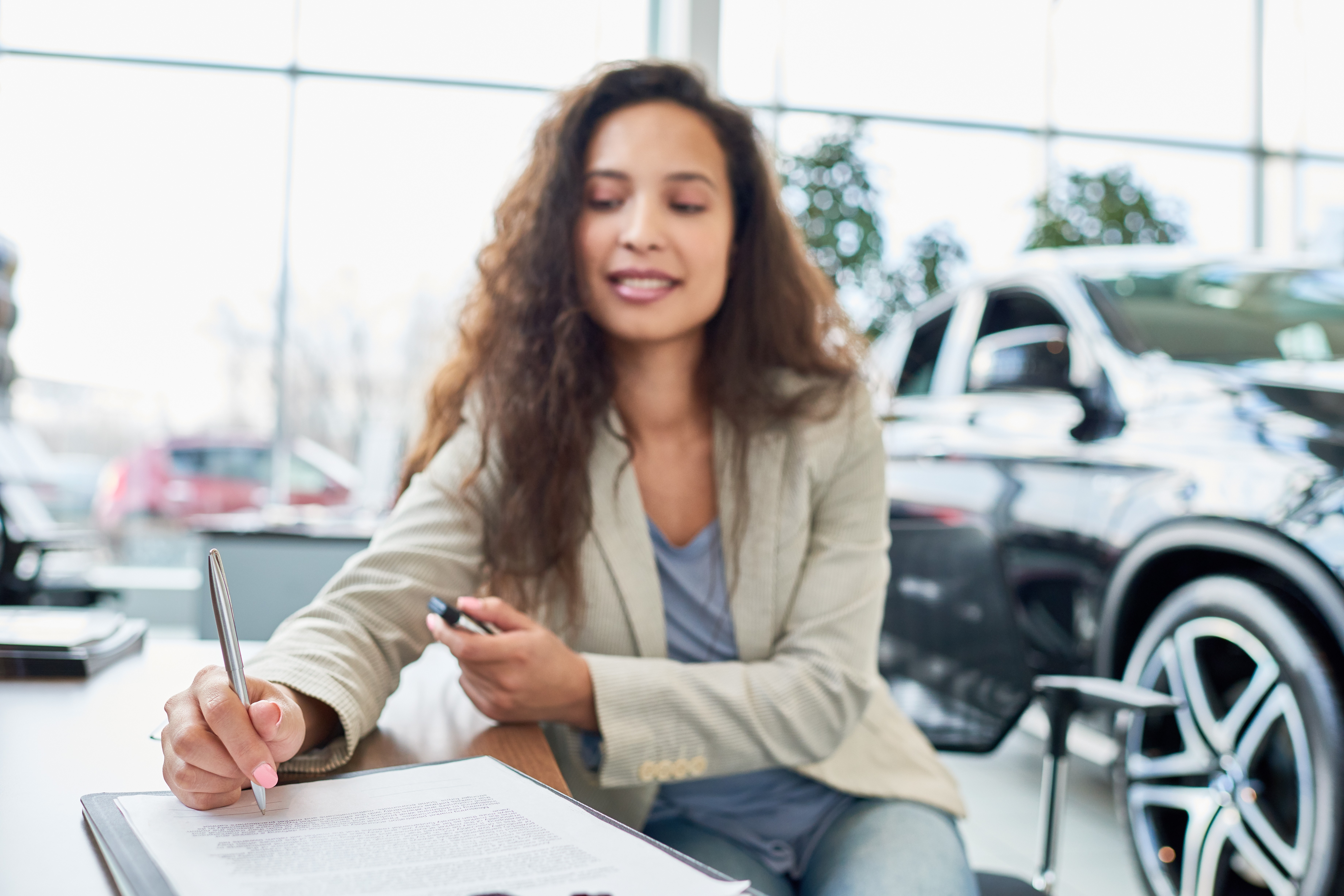 Customer signing registration paperwork