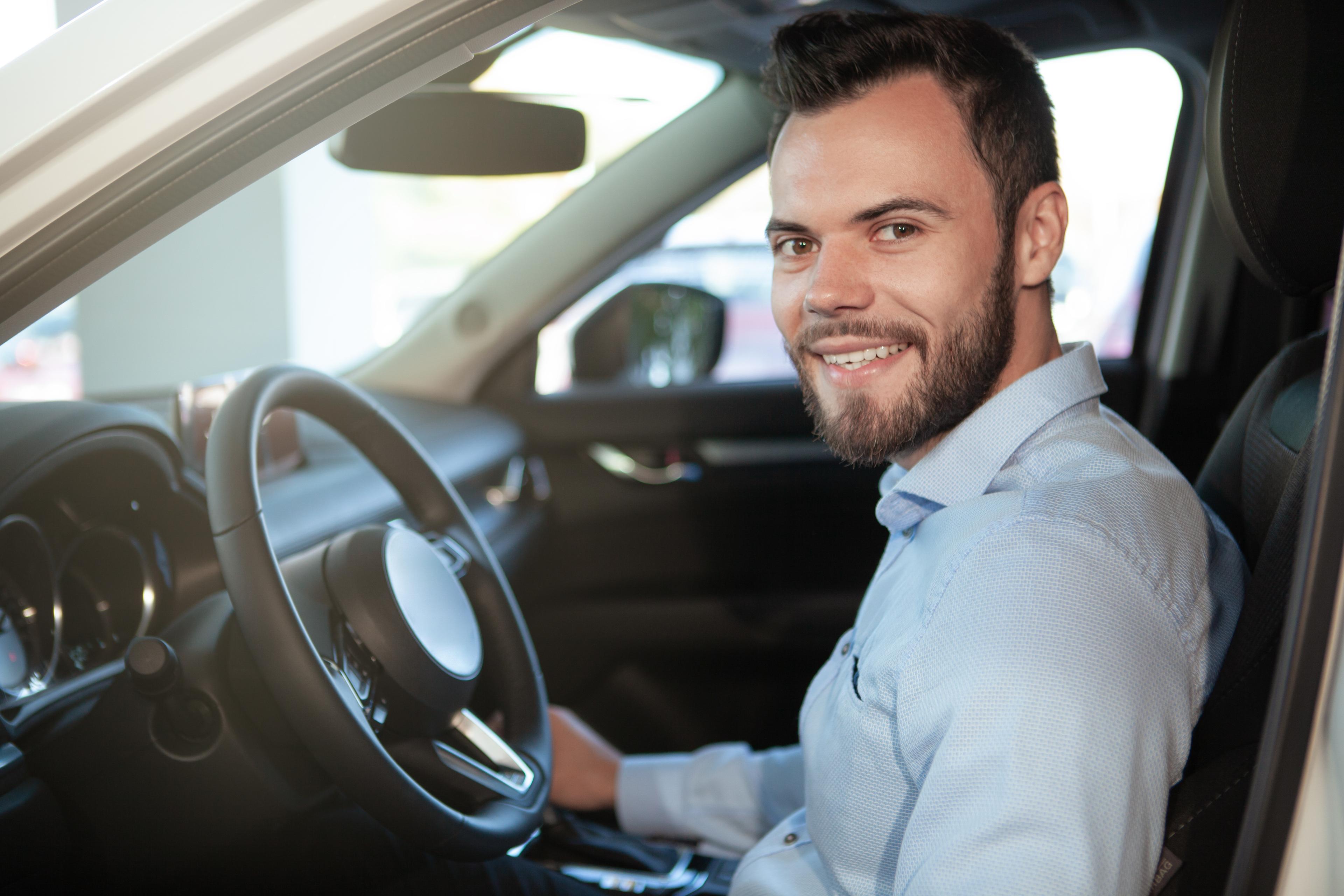 Driver seated in vehicle ready to complete registration