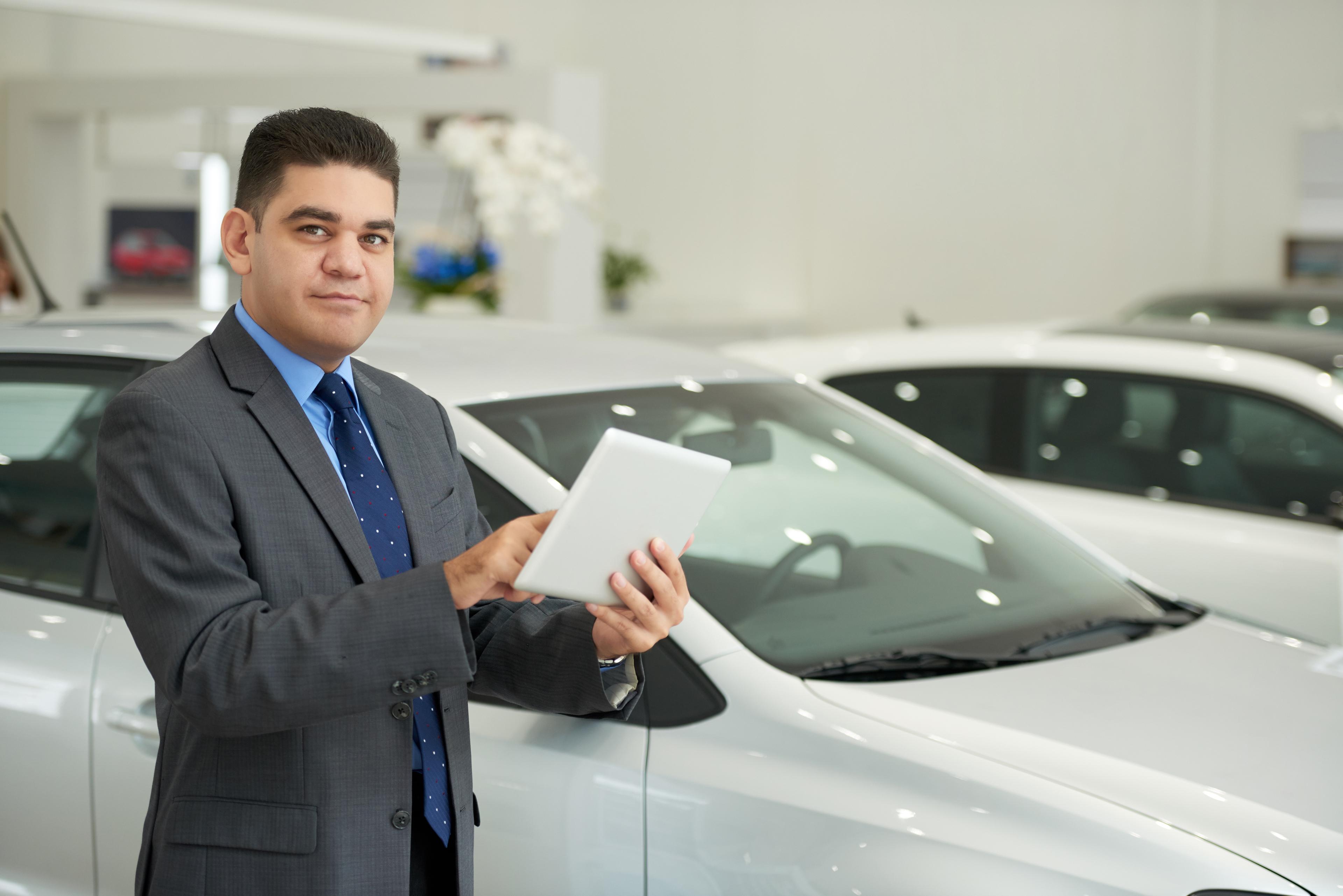 Dealership owner on the sales floor ready to partner on registration support